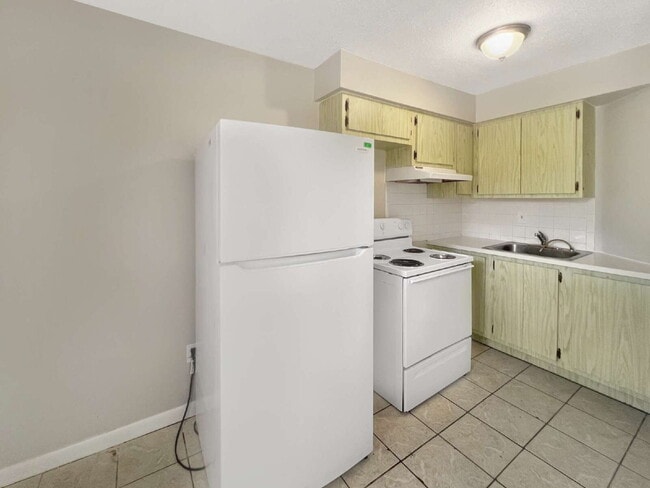 Building Photo - Budget-Friendly. Bold Personality. Big Aut...
