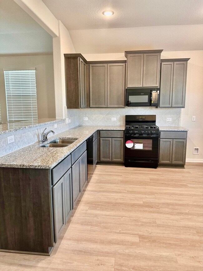 Beautiful cabinetry and brand new appliances make this kitchen so dreamy! - 507 Turtle Dove Dr