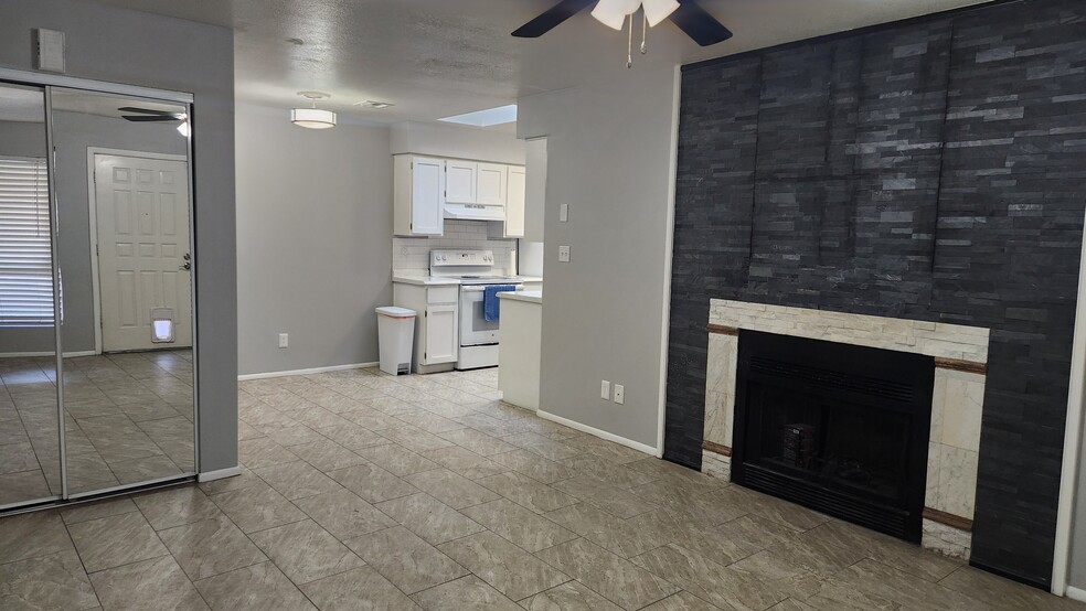 Fireplace and mirrored shelving closet - 4820 N 89th Ave