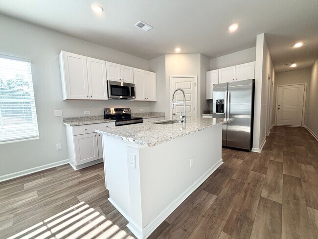 Building Photo - ABSOLUTELY BEAUTIFUL BRAND-NEW BUILD TOWNHOME