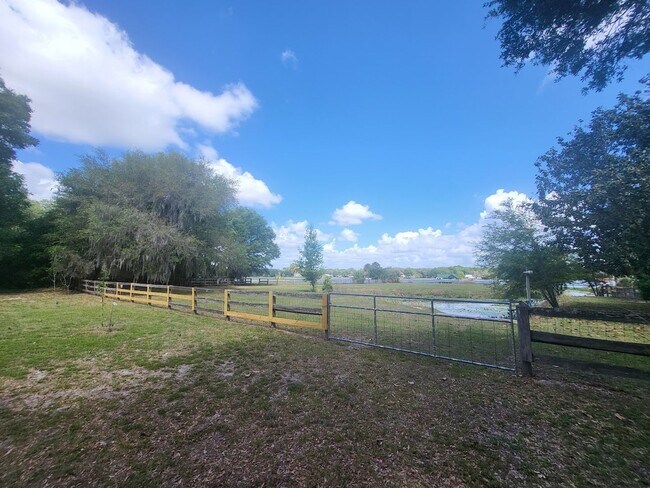 Building Photo - Little Lake Weir Waterfront FENCED 3BR/2BA on 6 Acres with Horse Barn, Private Boat Ramp & Dock