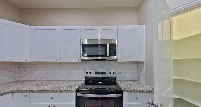 Building Photo - Spacious, Stylish, and Simply Perfect — 4 Bedroom Home