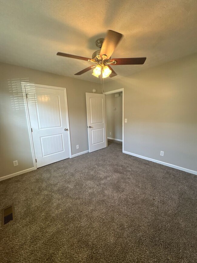 Building Photo - Charming Home with Covered Back Deck and Fenced in Yard...
