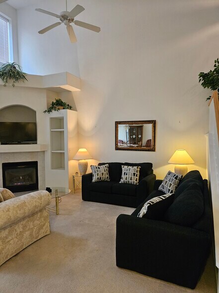 Living room with gas fireplace - 5252 Sunny Beach Ln