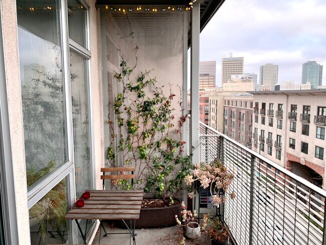 The balcony is wide, versatile, and perfect for Sunday brunch! - 630 Thomas L Berkley Way