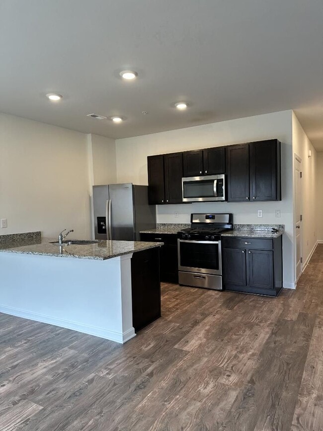 Building Photo - Modern Kitchen • Walk-In Closet • Private Primary Suite