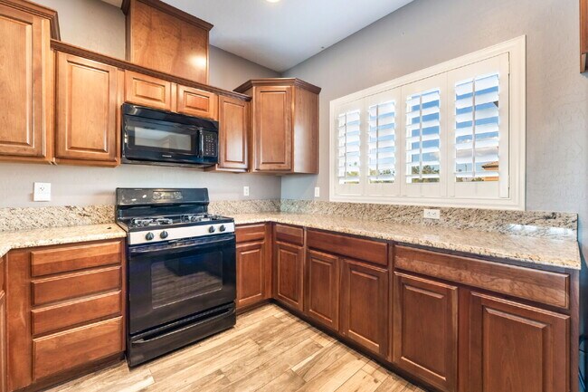 Building Photo - 3 bedroom, 2.5 bathroom Home with a 2 car garage  in  a Gated Community!