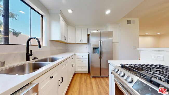Building Photo - 10220 De Soto Ave