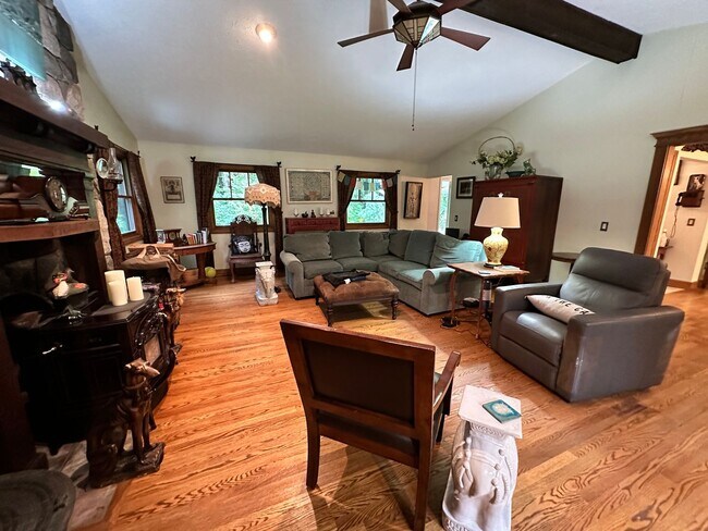 Building Photo - Dream Home in Highland, Michigan: Your Private Oasis on 5 Wooded Acres