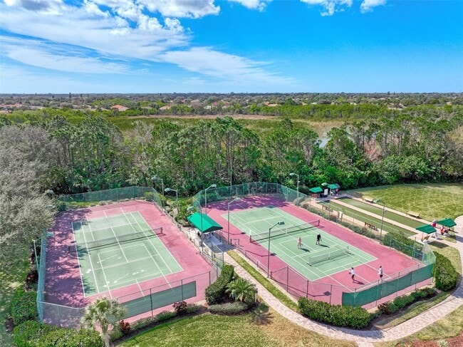 Building Photo - Elegant 3 Bedroom End-Unit Condo with Screened Lanai & Pond Views and A Private Garage