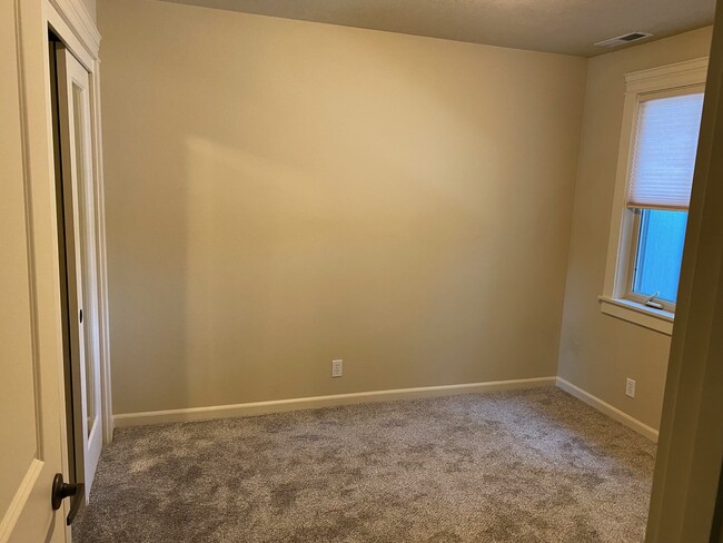 South-facing bedroom #3 with new blind, mirrored closet doors and new carpet - 5020 W Targee St