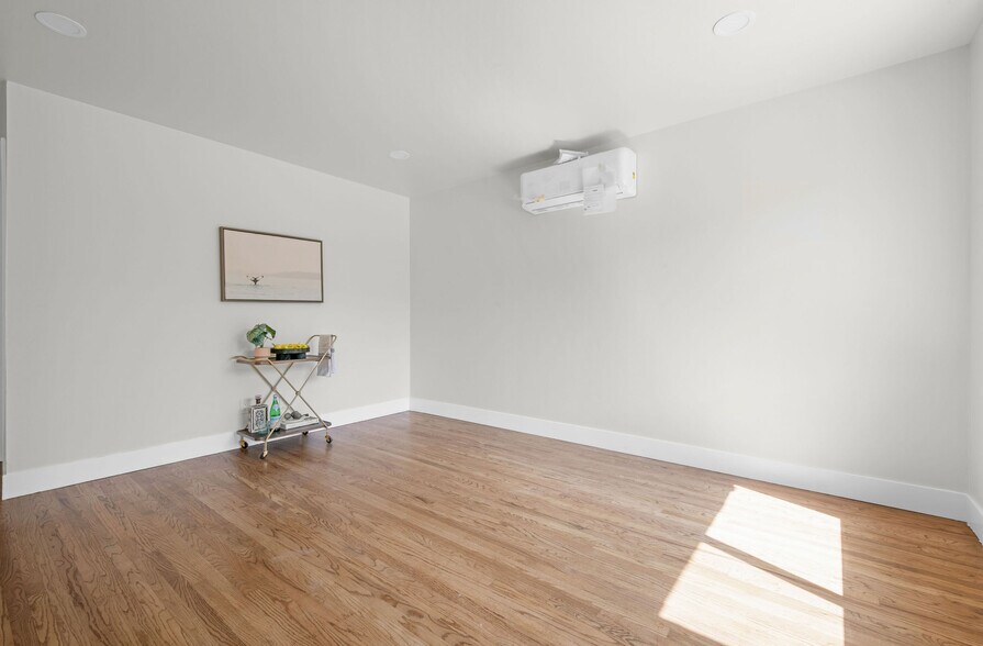 Living room with new paint, flooring, ac/heat - 9211 Earl St