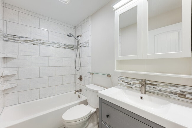 Building Photo - BEAUTIFUL UPDATED RAMBLER WITH LARGE GARGE