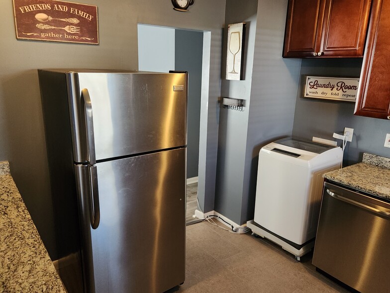 kitchen with fridge/washer/dryer/deep freezer/dishwasher - 8917 Loughran Terrace