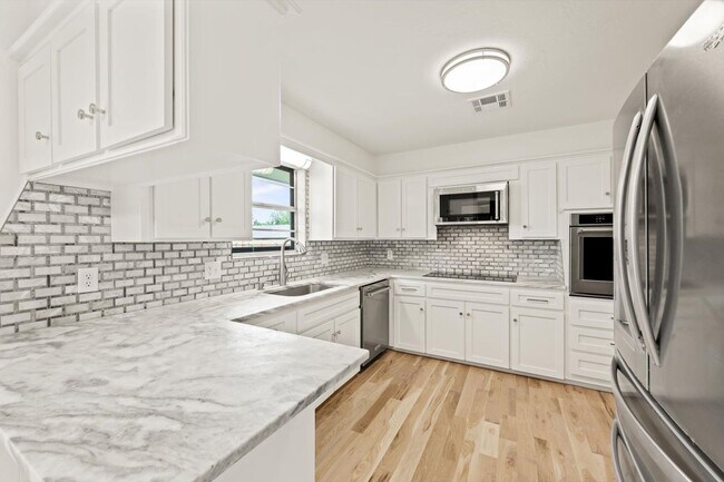 Building Photo - Modern Details and Interiors to a sought-a...