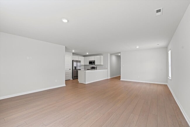 Building Photo - New 4BR Home in Whispering Woods – Spaciou...