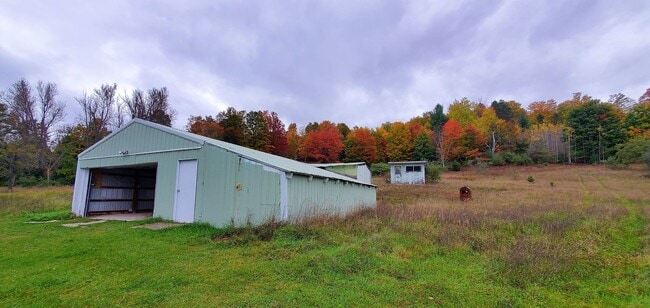 Building Photo - Renovated Farmhouse, 30+ Acres with Pole Barn!