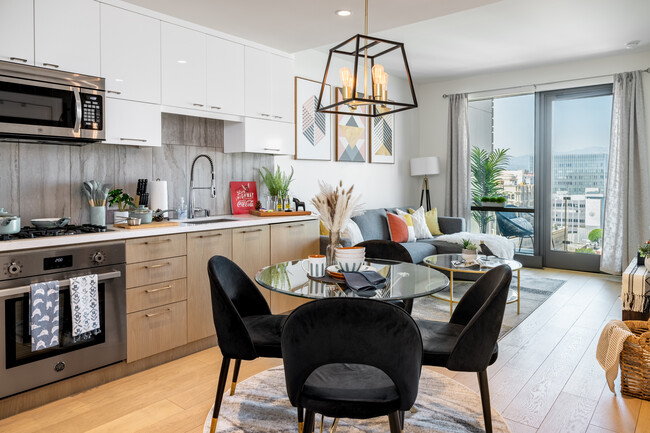 Open spaces create a seamless flow between the dining area and living room - 400 S Broadway