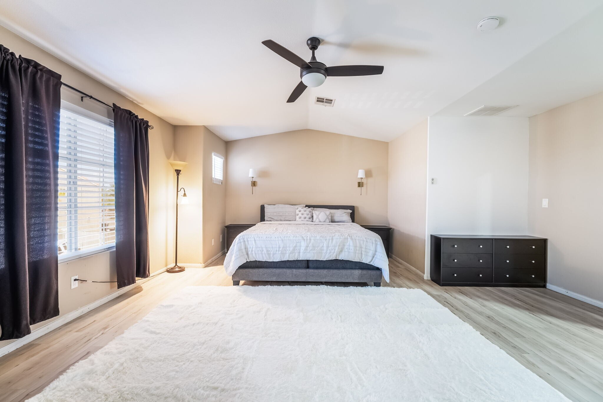 Bedroom featuring light wood-type flooring, a ceiling fan, and lofted ceiling - 1179 Antoinette St