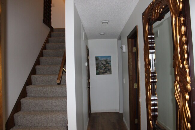 Stairs and Hallway View from Foyer - 2115 Pineshore Ct