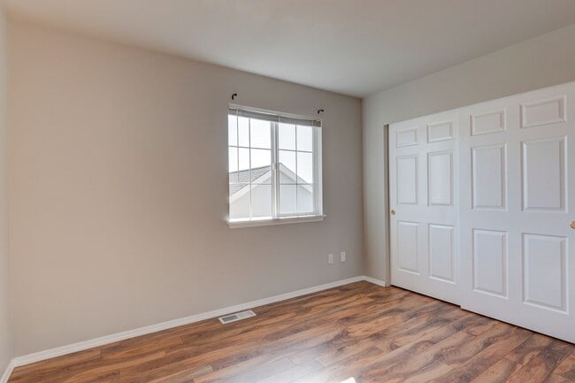 Building Photo - Spacious 4-Bedroom Home with Cozy Backyard...