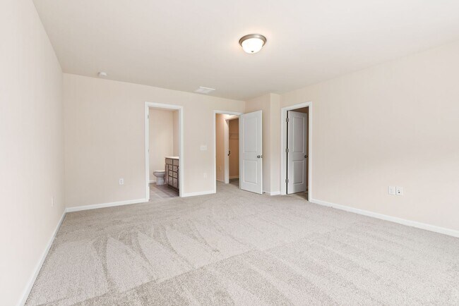 Building Photo - Like-New Townhome Walk to Downtown | Garage + Internet Included