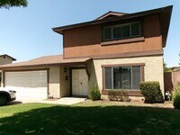 Building Photo - Clean and Ready - 3 bedrooms, 1 3/4 Bathrooms with back yard area.