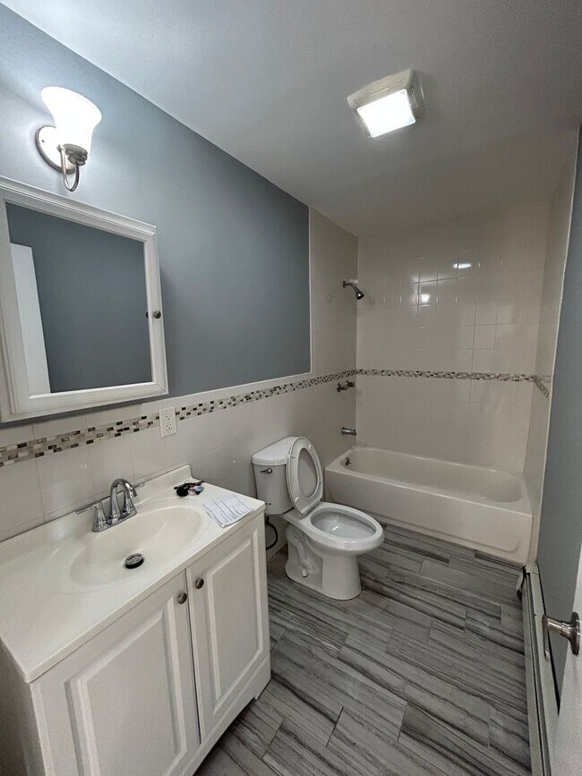 Building Photo - Discover Your Dream Home in Neptune: Spacious 4-Bedroom, 2.5-Bath with Private Backyard and Drive...