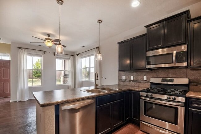 Building Photo - Immaculate 3-Bedroom Townhome with Stainless Steel Appliances and Attached Garage Near Peterson SFB