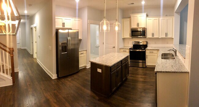 Kitchen with Adjacent Laundry Room - 5100 Gracious Drive