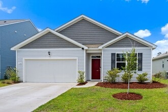 Building Photo - Modern 4BR Home with Screened Porch & Pond Views | Sun Colony, Longs SC