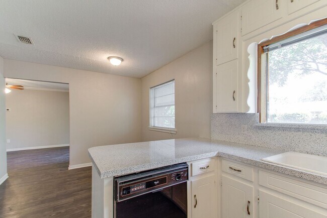 Building Photo - No Carpet! Great tree shaded yard!