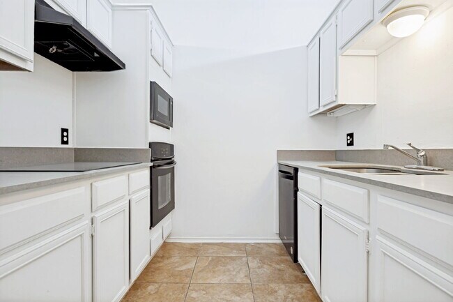 Building Photo - Spacious Dallas Condo with Unbeatable Storage, Private Patio & Carport