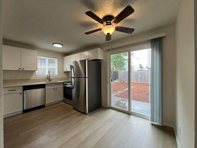 Building Photo - Inviting 2 Bedroom Home with Open Layout, Stainless Steel Appliances & Private Outdoor Retreat