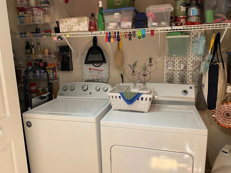 Washer/dryer included in unit; to the left is a small pantry - 1483 Keys Crossing Dr NE