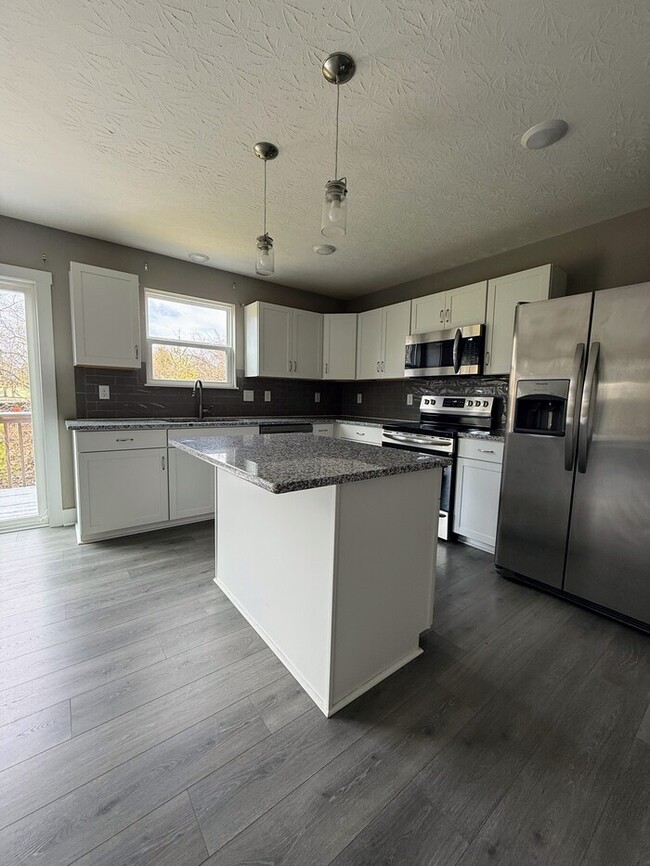 Building Photo - Gorgeous 4 Bedroom Home with Finished Lowe...