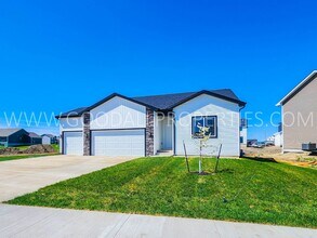 Building Photo - Spacious Waukee Ranch | 4 Bedrooms | 3-Car Garage | Finished Basement