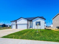 Building Photo - Spacious Waukee Ranch | 4 Bedrooms | 3-Car Garage | Finished Basement