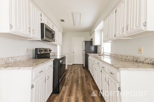 Building Photo - 3 BR/2BA | Newly Renovated Single Family Home | Fireplace in living room | Fenced backyard!