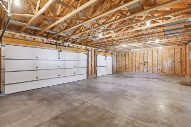 Custom garage floor with swales and curb to keep snow melt under your car. - 924 Eleanor Ave