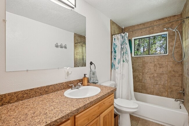 Building Photo - Springville Condo with Updated Kitchen, Deck & Creekside Setting