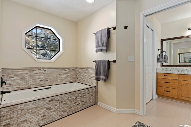 Building Photo - Beautiful home single level entry with out buildings and amazing landscaping - shorter term lease...