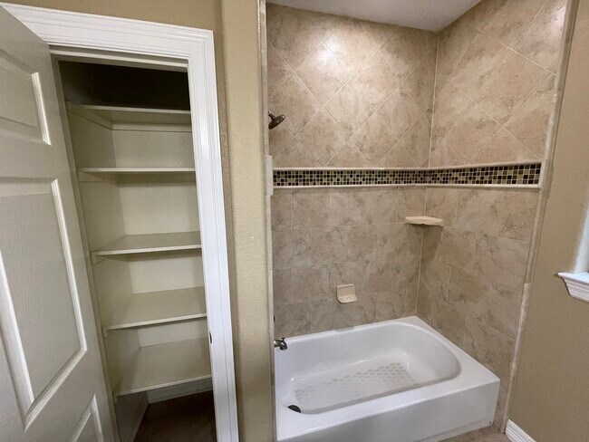 2nd hallway bathroom with linen closet - 600 River Bend Dr