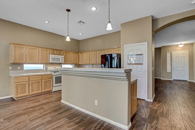 Building Photo - Gorgeous NW Single Story! 3 Car Garage! Serene Backyard.