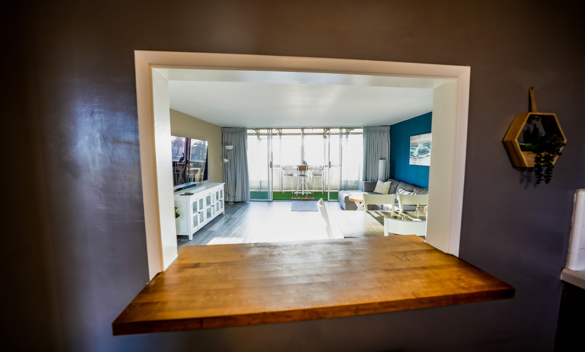 View of Balcony through Bar Window in Kitchen - 1054 E 2nd St