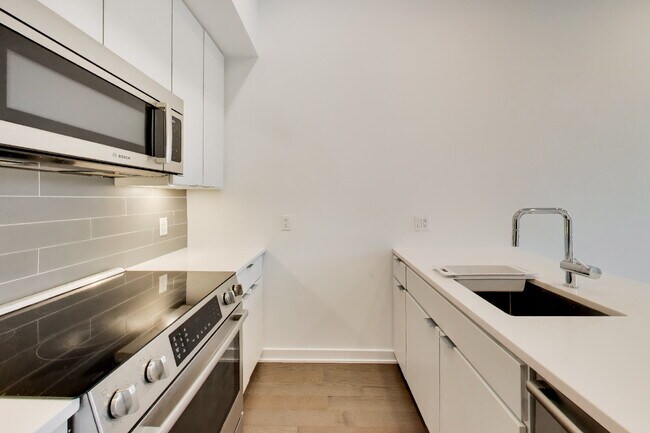 Building Photo - Top floor residence in elevator building with sweeping views.