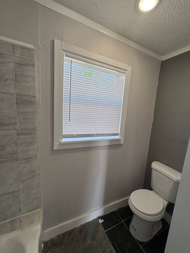 Building Photo - Just Renovated-Right off I-27 and 50th Street