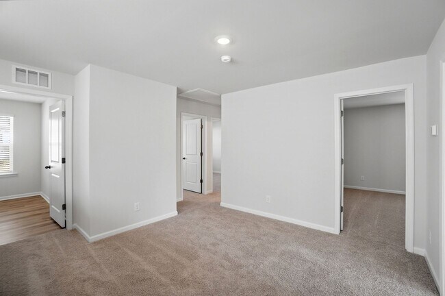 Building Photo - 4BR Home in The Pines at Paw Creek – New Construction + Private Deck