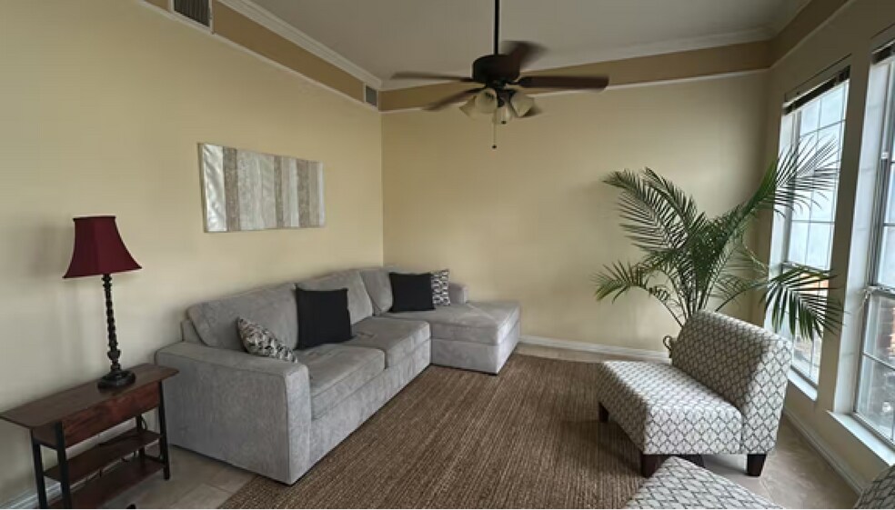 Settle into the sunroom, soak in the quiet comfort of peaceful views - 10913 Alexandria Dr