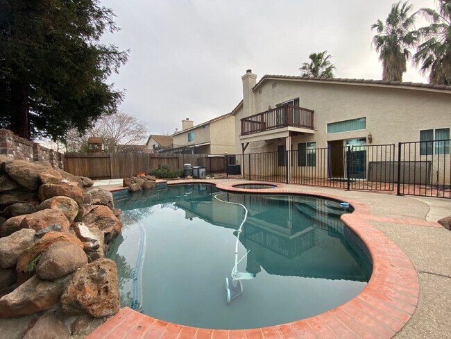 Building Photo - Spacious Home with a Pool & Hot Tub!